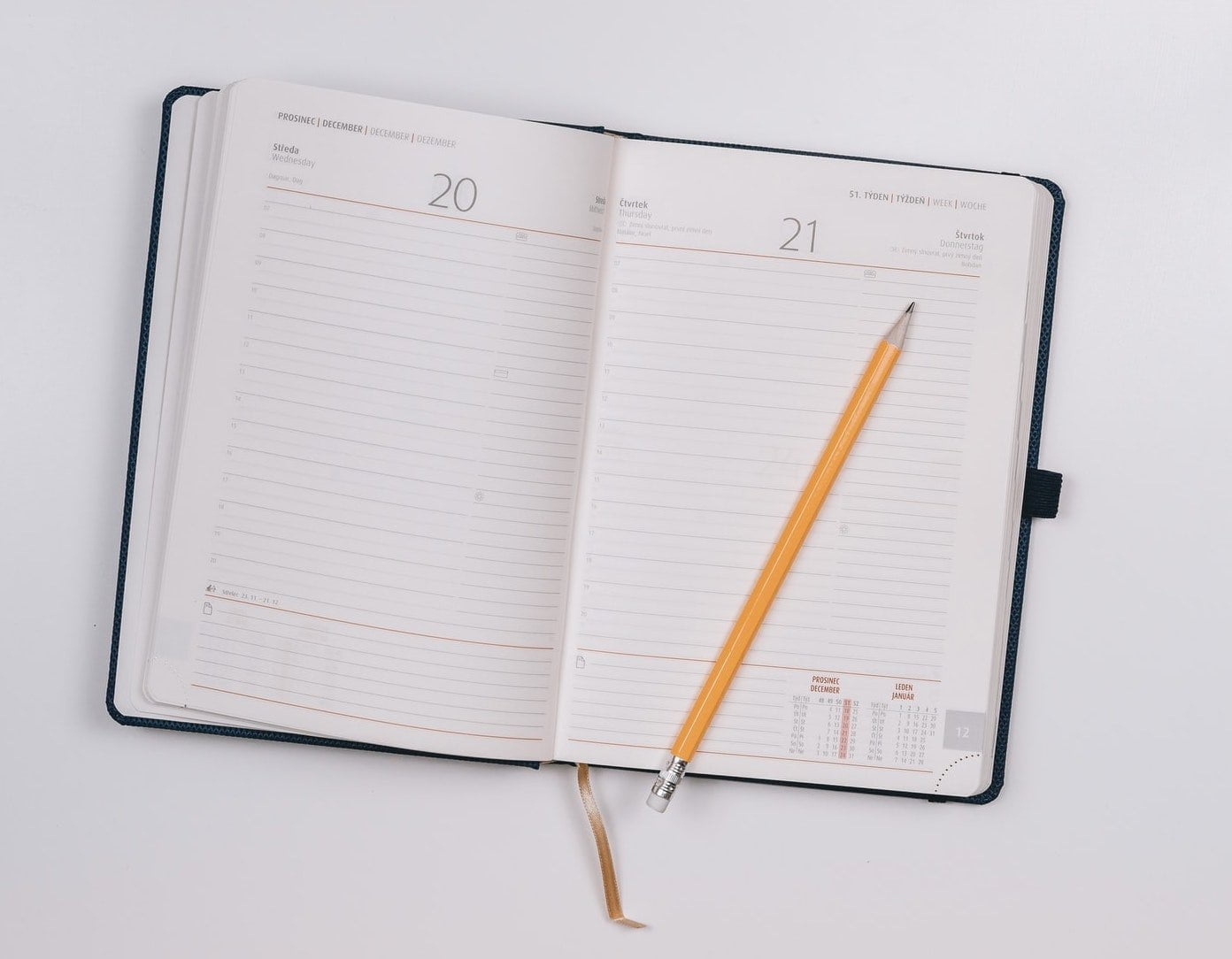 Calendar with pencil to schedule your day and stay focused when working from home.