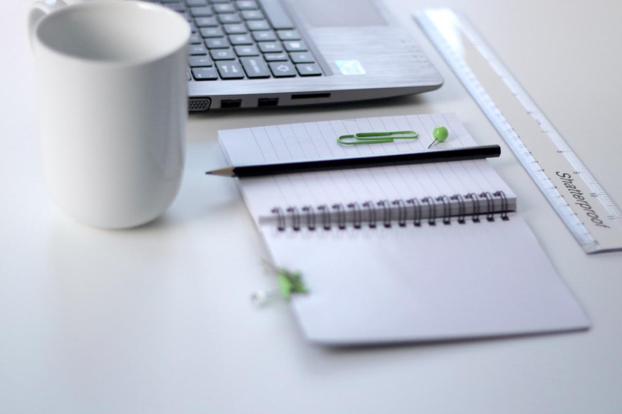 todo-list with computer and ruler on white table